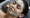 woman receiving a facial with a green mask applied, illustrating a traditional facial experience as part of a hydrafacial vs traditional facial comparison.
