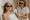 woman in protective glasses receiving laser hair removal treatment on her underarm from a technician in white uniform and gloves.