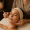 Esthetician gently performing dermaplaning during a Swiss Facial.